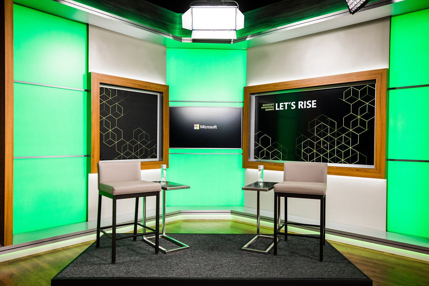 Photo of presenter set up with two chairs for the Let's Rise Microsoft Advertising event.